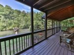 Screened in back porch overlooking river